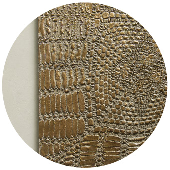 Textured and stamped effect of the decorative mortar Microbond on a wall.