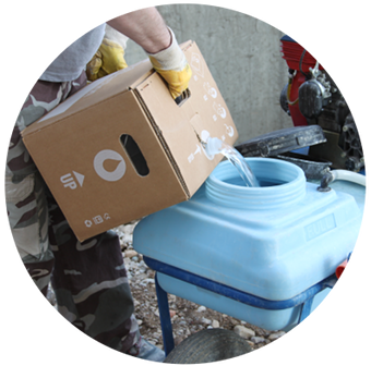Pouring Evercrete Pavishield from the handy cardboard Ecobox into the spray pump