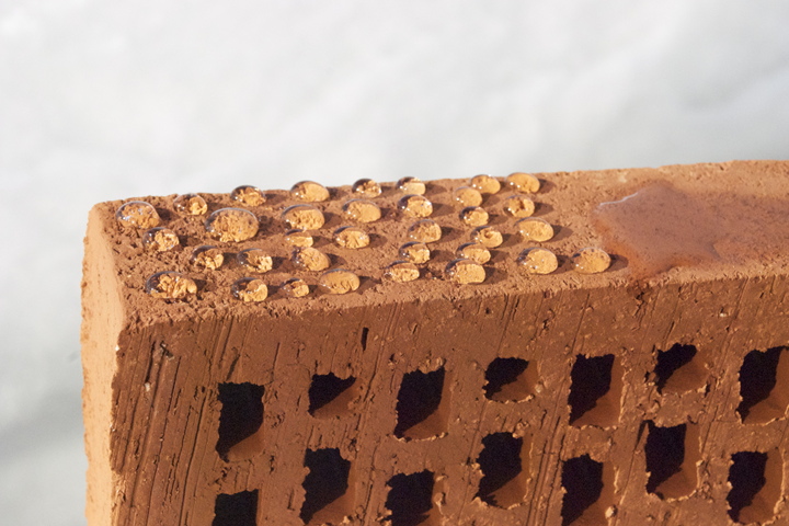 Water drops remain on the surface of the brick treated with BrickCover