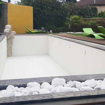 Swimming pool overlayed with white Poseidone microcement render