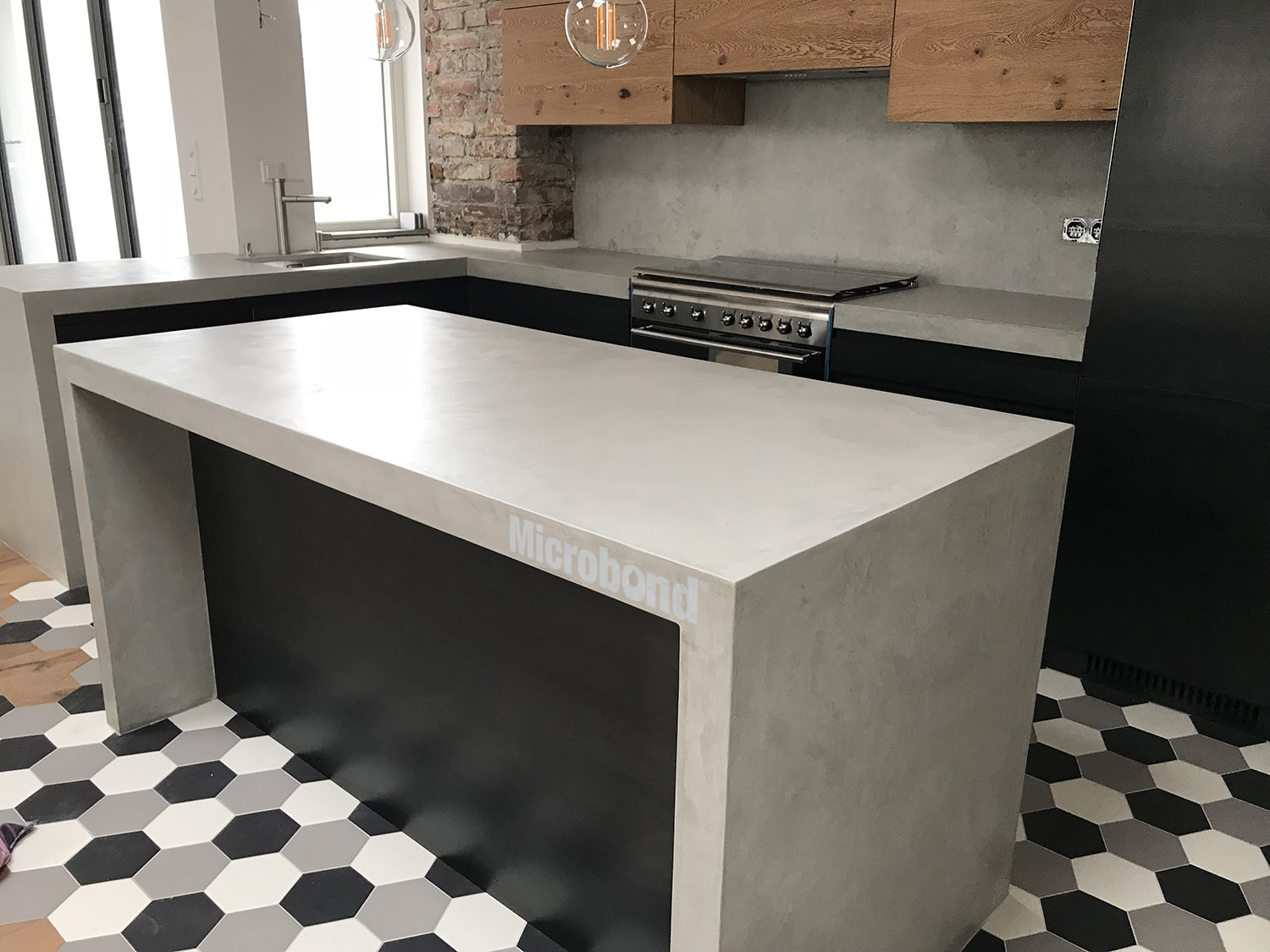 Kitchen countertop covered in microcement matching the backsplash