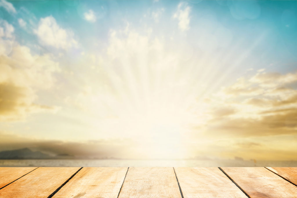sun rays at dawn on a wooden floor